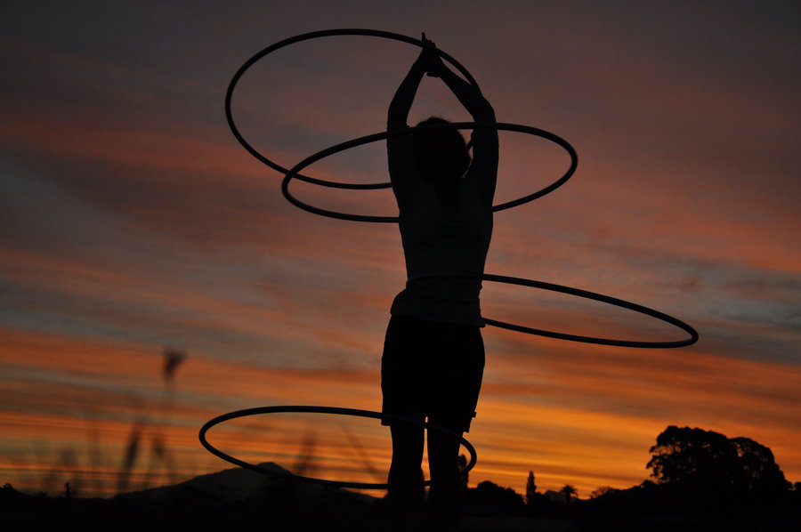 hooping_in_the_sunset_by_0_circus_freak_0-d332jkp.jpg